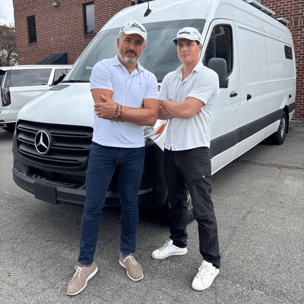 Matthew's Electrical Services team posing in front of a white van, Charlotte