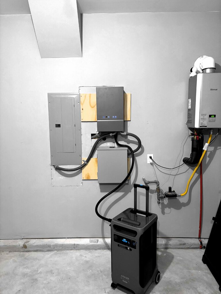Finished home backup power setup with conduit to a sub-panel in a garage