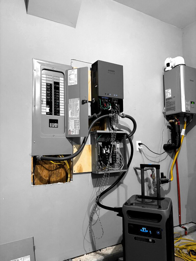 Garage wall with breaker panel and backup power unit in Charlotte, NC